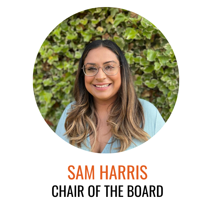 Sam Harris, Chair of the Board, Sam pictured smiling in front of greenery with a blue top on