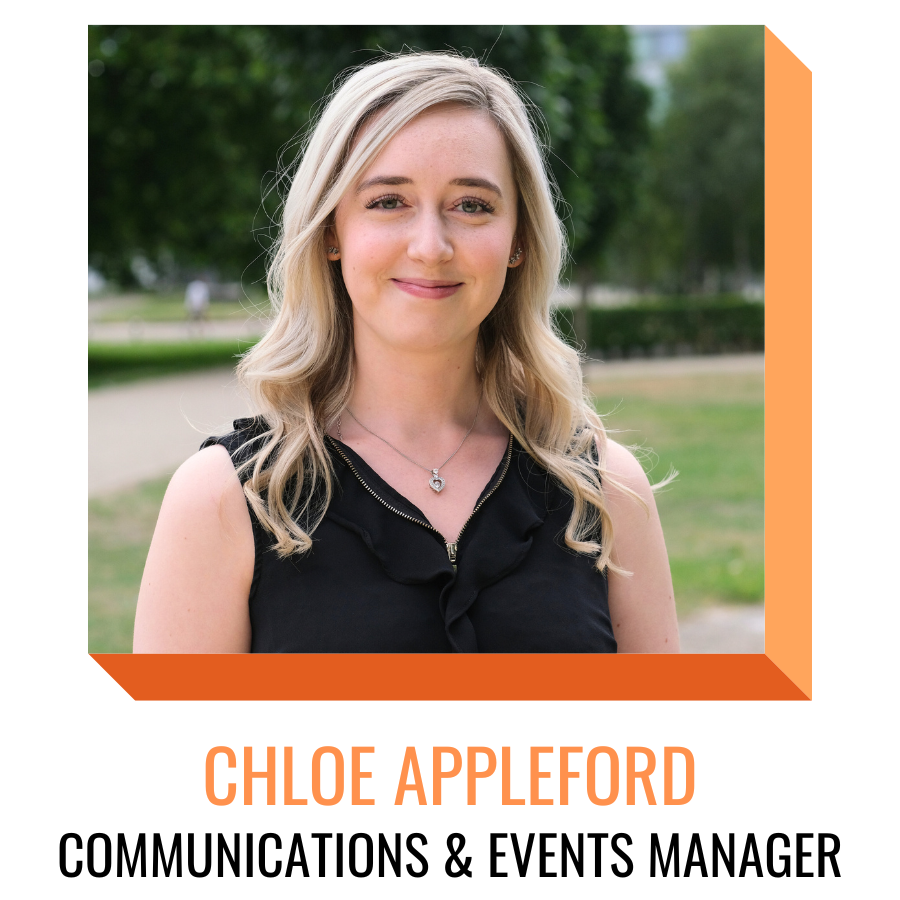 chloe appleford, communications and events manager, smiling in front of greenery