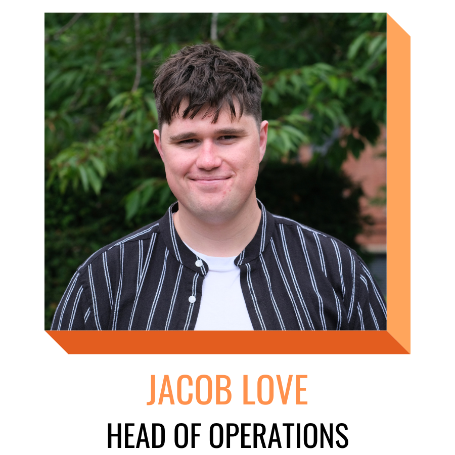 jacob love, head of operations, smiling in front of greenery