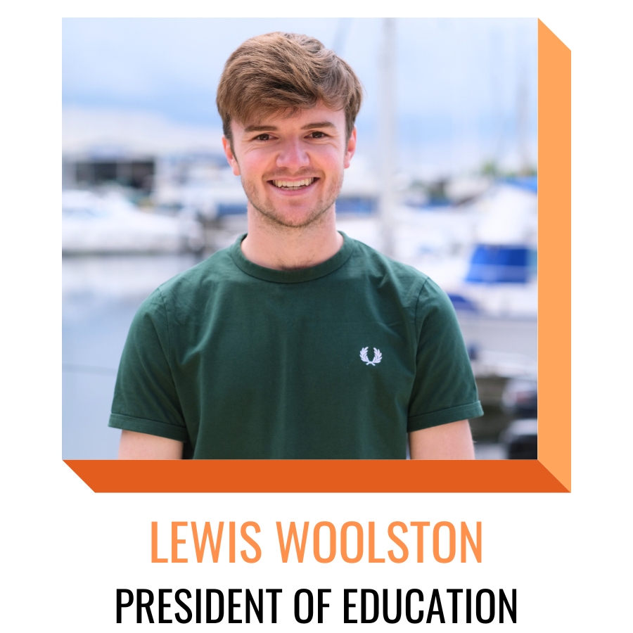 lewis woolston, president of education, smiling in front of the marina
