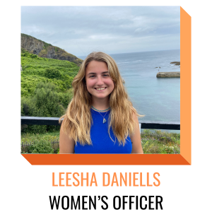 leesha daniells, womens officer, pictured smiling with a blue shirt with the ocean behind