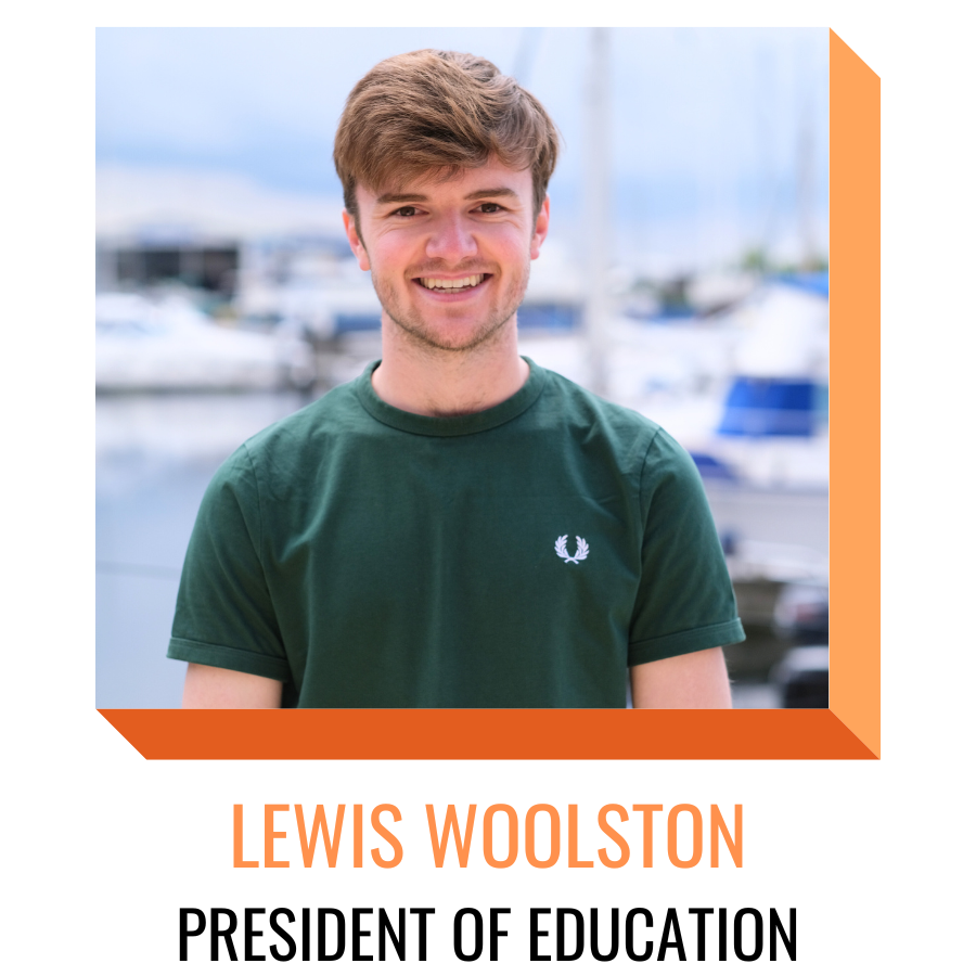 Lewis Woolston, president of education, smiling in front of the marina